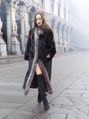 Black mink coat with silver fox trim, front slit and long length