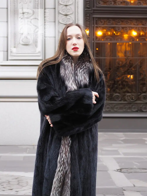 Black mink coat with silver fox collar, arms crossed and open front