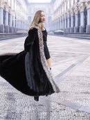 Black mink coat with silver fox trim, flared hem and long sleeves