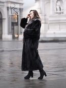 Long black mink coat with silver fox collar and oversized fur cuffs