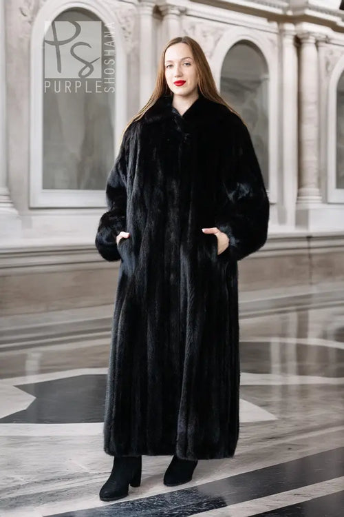 Black mink full-length coat with button front and high collar, long sleeves.