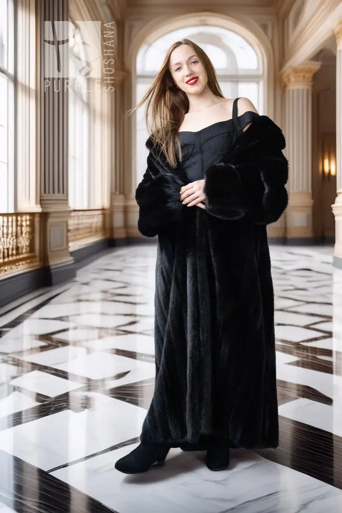 Black mink full-length coat with off-shoulder style and front button closure
