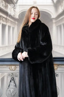 Black mink full-length coat with wide fur collar and long sleeves, open front