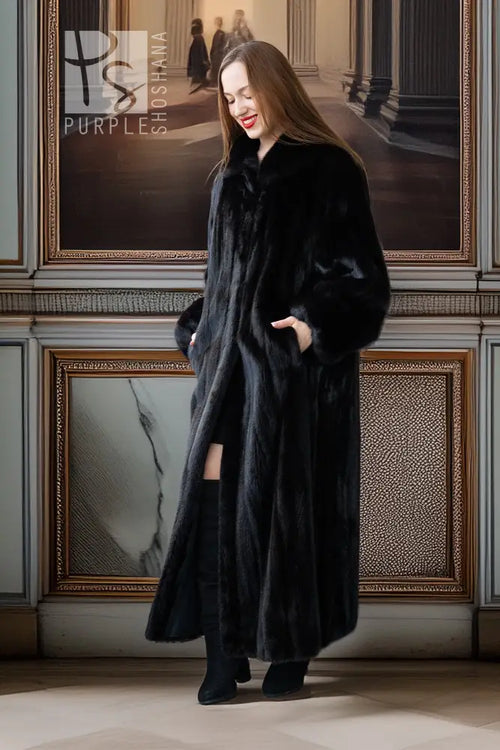 Black mink coat, full length, high collar and button front; side view.