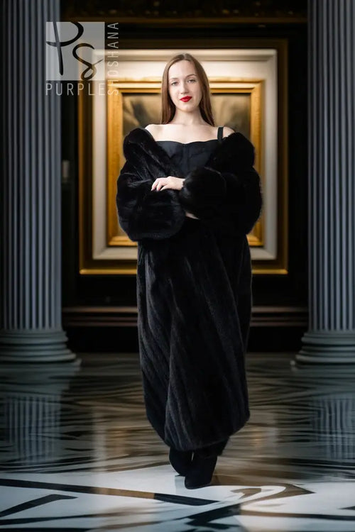 Black mink full-length coat with off-shoulder neckline and long sleeves
