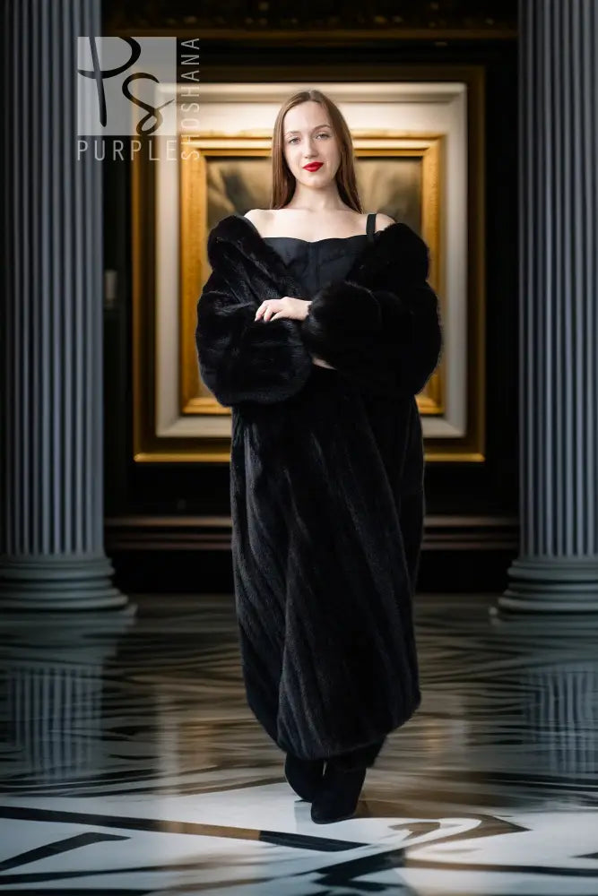 Black mink full-length coat with off-shoulder neckline and long sleeves
