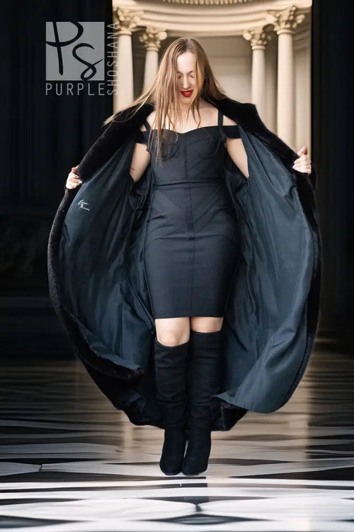 Black mink full-length coat with wide sleeves, open front, and matching belt detail