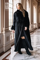 Black mink full-length coat with high collar and button front; front view with open hem.