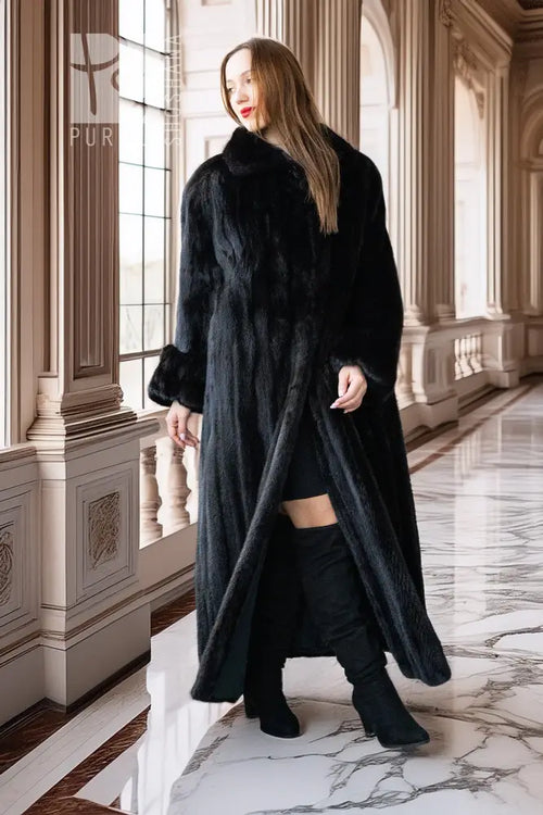 Black mink full-length coat with high collar and button front; front view with open hem.