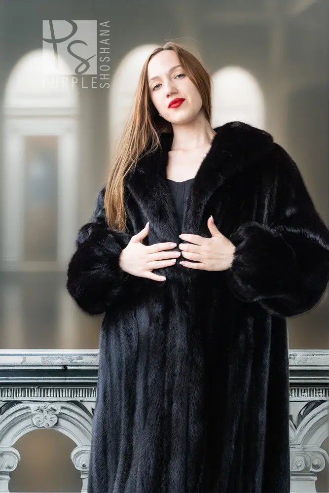 Black mink coat with raised fur collar and textured fur finish, open and flowing