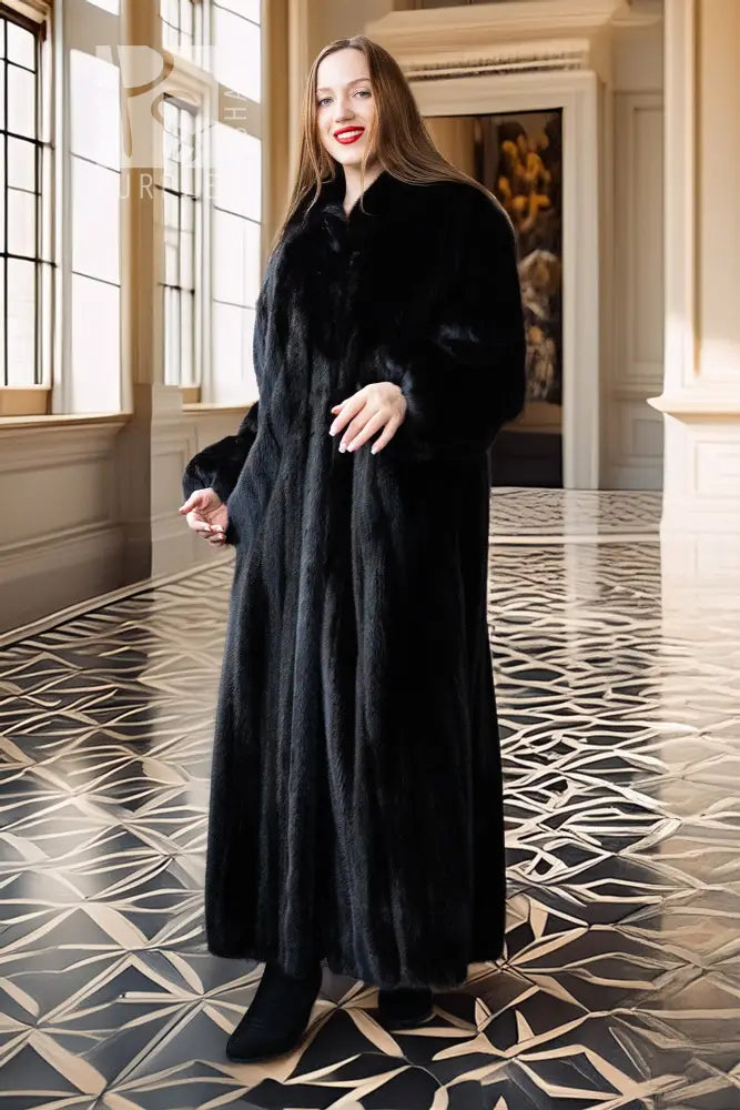 Black mink full-length coat with high collar and button front; standing front view.