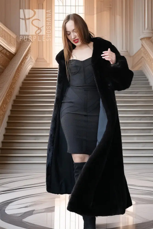 Black mink coat with open front and long drape, fur cuffs and wide sleeves
