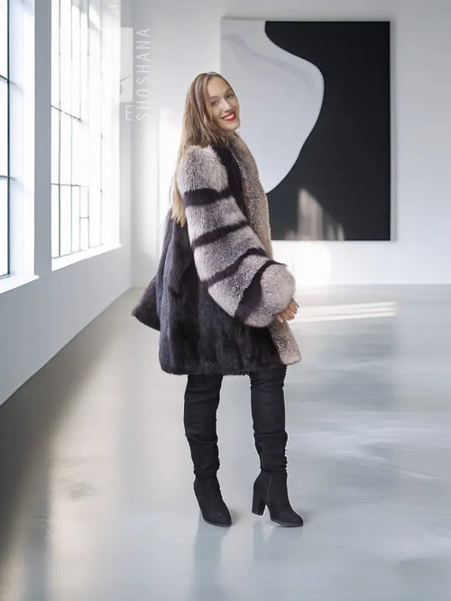 Mink fur jacket with gray fox-fur collar and striped sleeves, full-body side view.