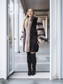 Mink fur jacket with gray fox-fur trim and striped sleeves, standing front view.