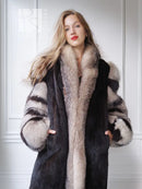 Dark mink jacket with tan fur lapel, open front, and contrast fox-fur sleeve bands