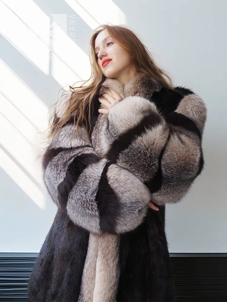 Mink fur jacket with gray fox-fur collar and wide striped sleeves, close-up.