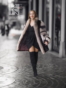 Long mink fur jacket with gray fox-fur collar and striped sleeves, side view.