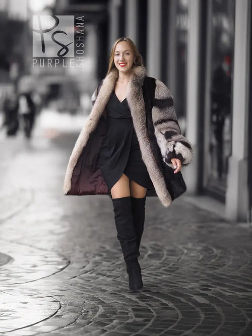 Long mink fur jacket with gray fox-fur collar and striped sleeves, side view.