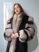 Dark mink jacket with long fur collar and gray, black and white striped cuffs