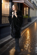 Black mink hooded coat with soft hood and front pockets, mid-calf length