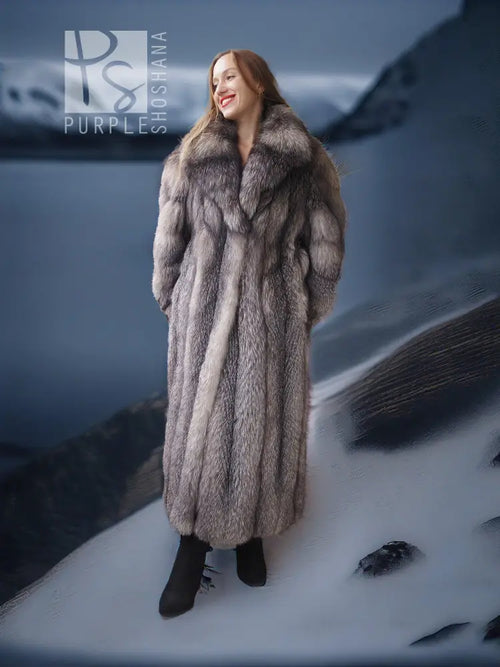 Long fox fur coat with shawl collar, gray pelt texture and open front over black dress