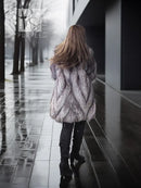 Gray silver fox fur coat from back with wide shoulder coverage and cuffs