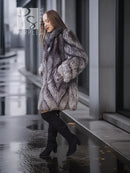 Gray silver fox fur coat with textured pattern and wide, draped sleeves