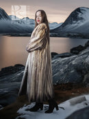 Long fur coat with tall collar and beige-brown striped fur, full-length side view.