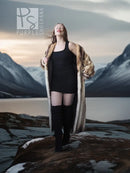 Long striped fur coat draped open, tan and dark fur with relaxed, straight hem.