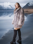 Platinum silver fox fur jacket in platinum gray with open look over black dress and boots