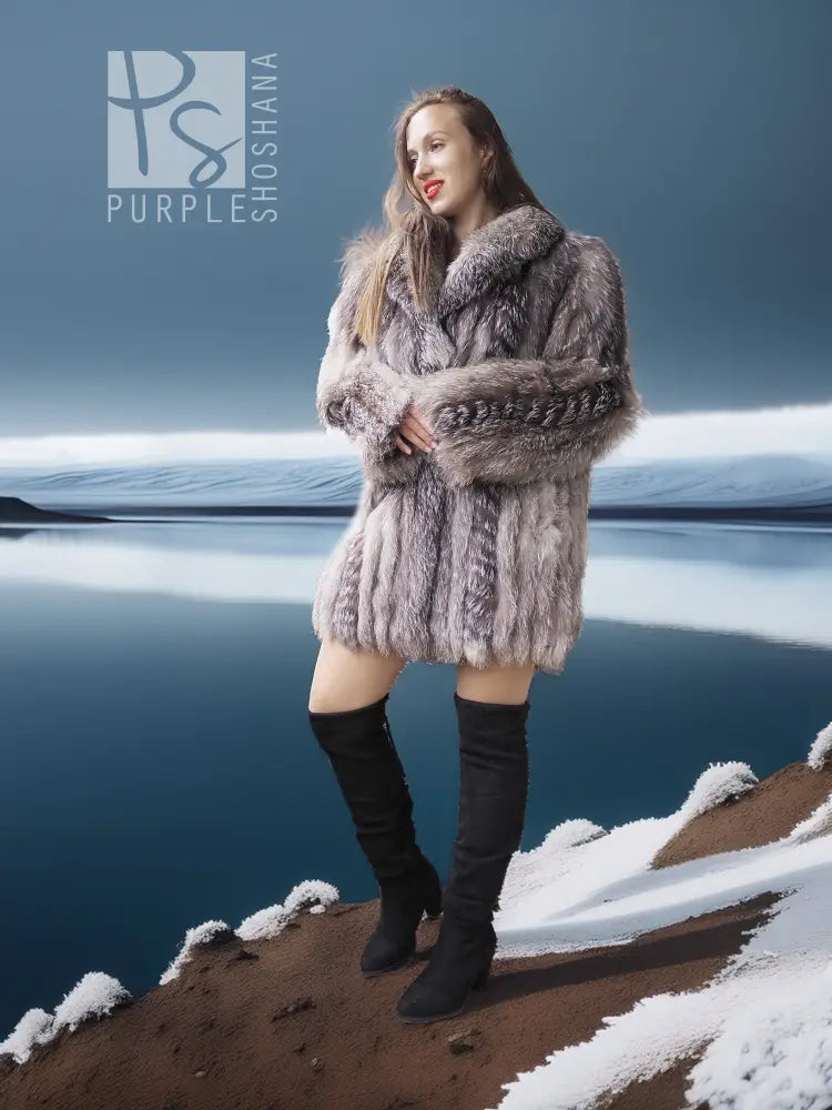 Platinum silver fox fur jacket with shawl-style collar over black dress and boots