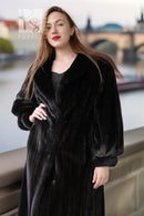 Black fur coat with button-front, long sleeves, knee-length, side view.