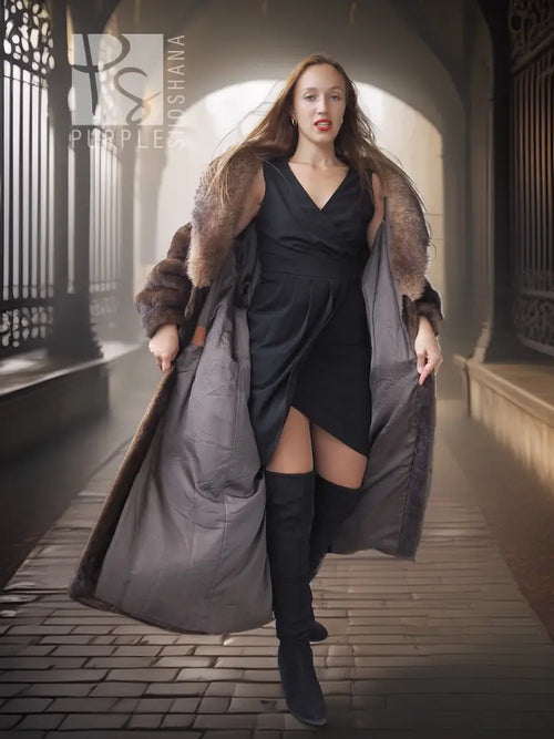 Long dark full-length coat with brown mink-style fur trim and open front silhouette