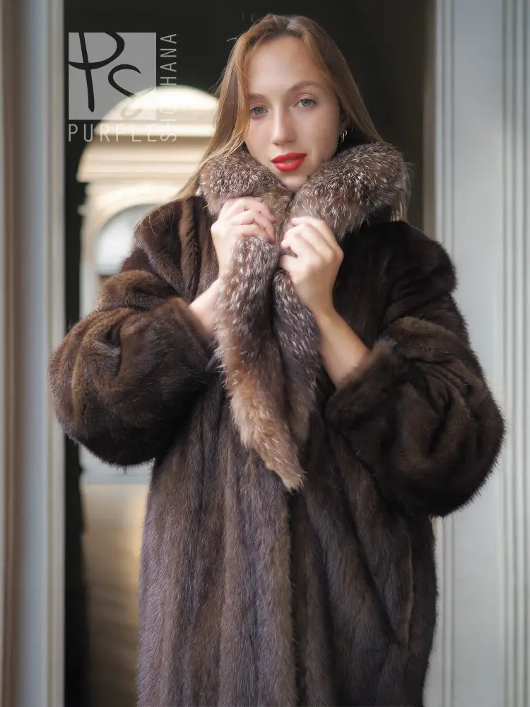 Mink fur coat close-up with fox-trim collar detail and wide, plush sleeves