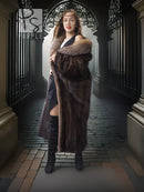 Long mink fur coat with fox-trim collar; curved hem and plush sleeves in dark tone