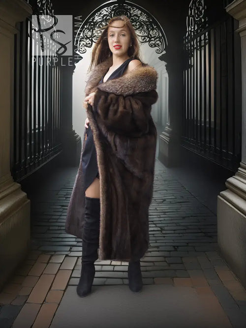 Long mink fur coat with fox-trim collar; curved hem and plush sleeves in dark tone