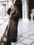 Mahogany-brown full-length mink coat with fur-trimmed collar and long sleeves