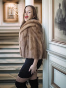 Tan mink fur opera jacket with hood, close-up of fluffy collar and texture