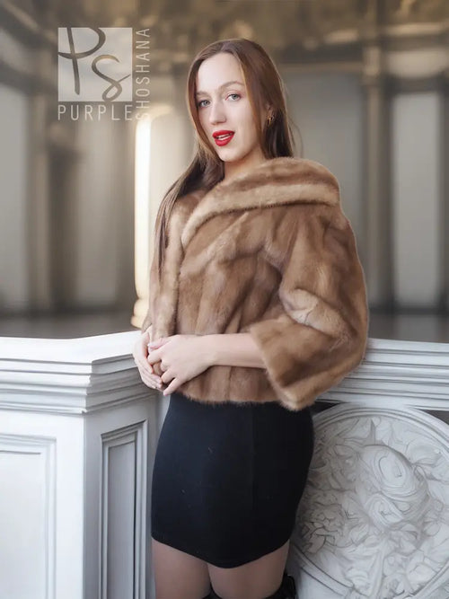 Vintage mink opera jacket with hood, tan fur shawl collar, worn with a black skirt.