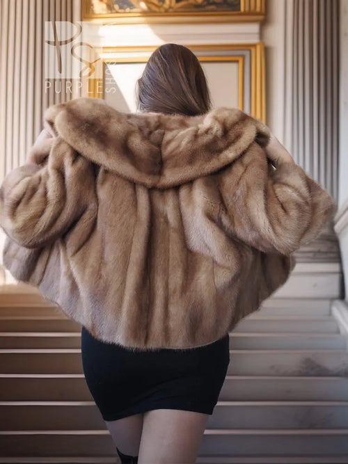 Back view of vintage mink opera jacket with hood, tan fur and voluminous shoulders.