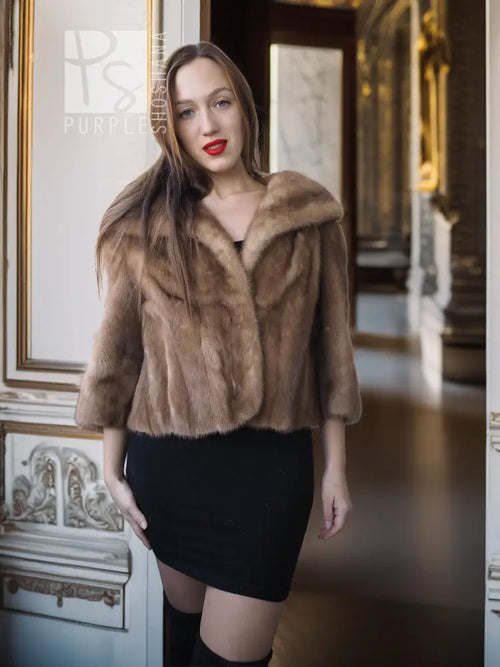 Vintage mink opera jacket with hood, tan fur texture, three-quarter view front.