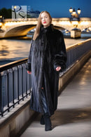 Long black mink fur coat, full-length open front, long sleeves and side pockets.