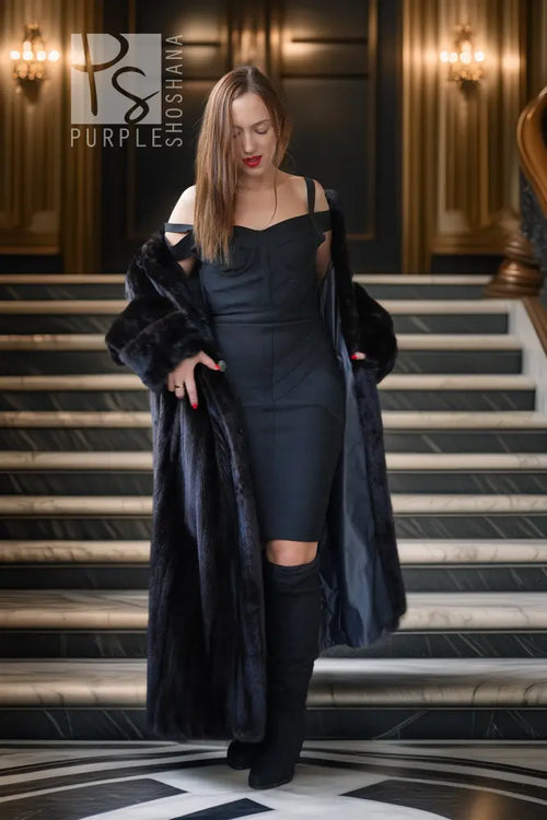 Black mink fur coat, open front with plush cuffs and full-length silhouette.