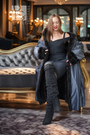 Black mink fur reversible-style coat with fur collar and button closure, knee-length view.