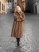 Brown mink fur coat with hood, long length, and dark underlayer at cuffs.