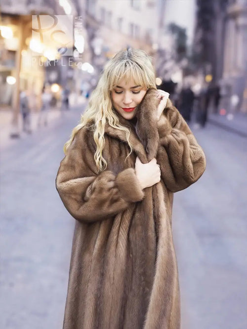Women's brown mink fur coat close-up, plush collar and button-front placket visible.