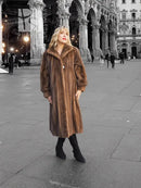 Women's brown mink fur coat with plush collar, front view, long full-length hem.