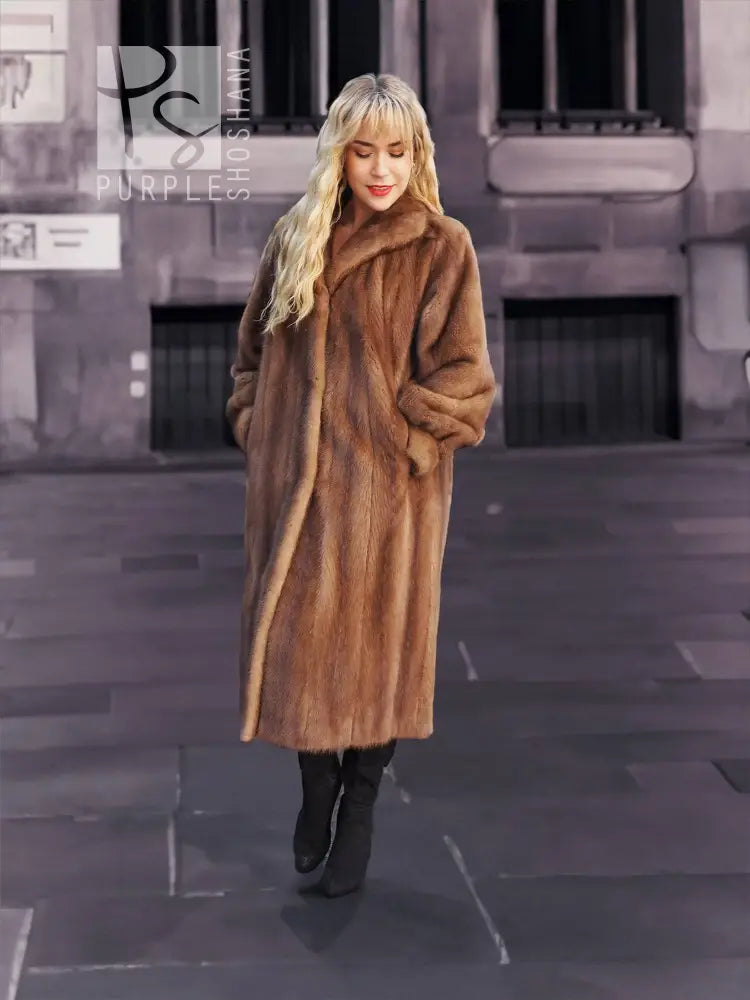 Women's brown mink fur coat with button front and soft, plush collar detail.