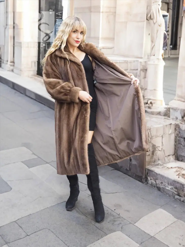 Brown mink fur coat with hood, front button closures, and full sleeves.