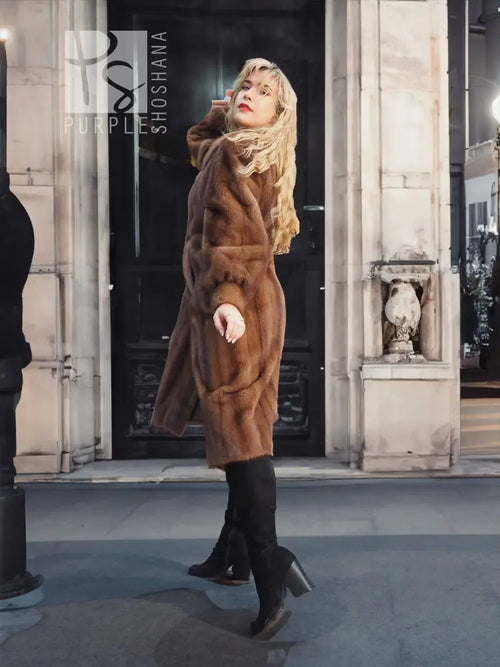 Women's brown mink fur coat, full-body view with plush collar and long sleeves.